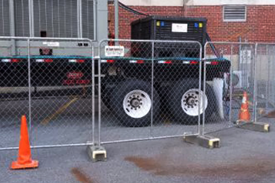 truck behind panel fencing