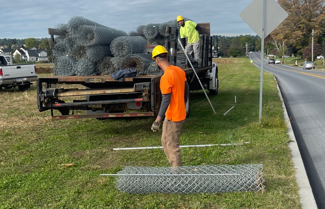 chain link fence - rolls on the ground - installing fence