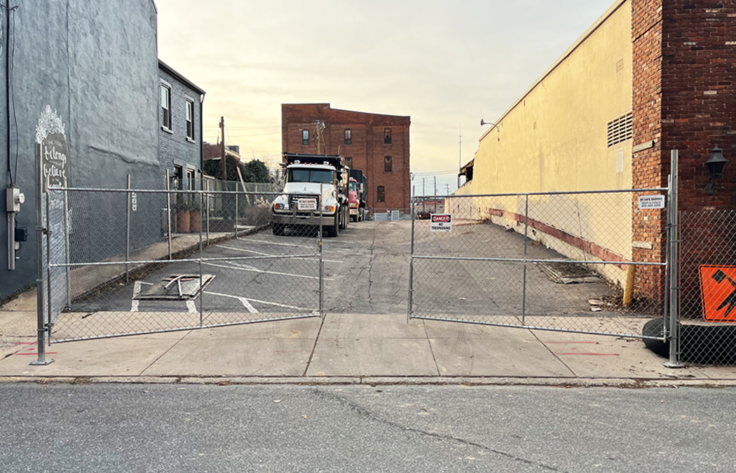 gates along a bike path at train tracks to slow down and protect riders