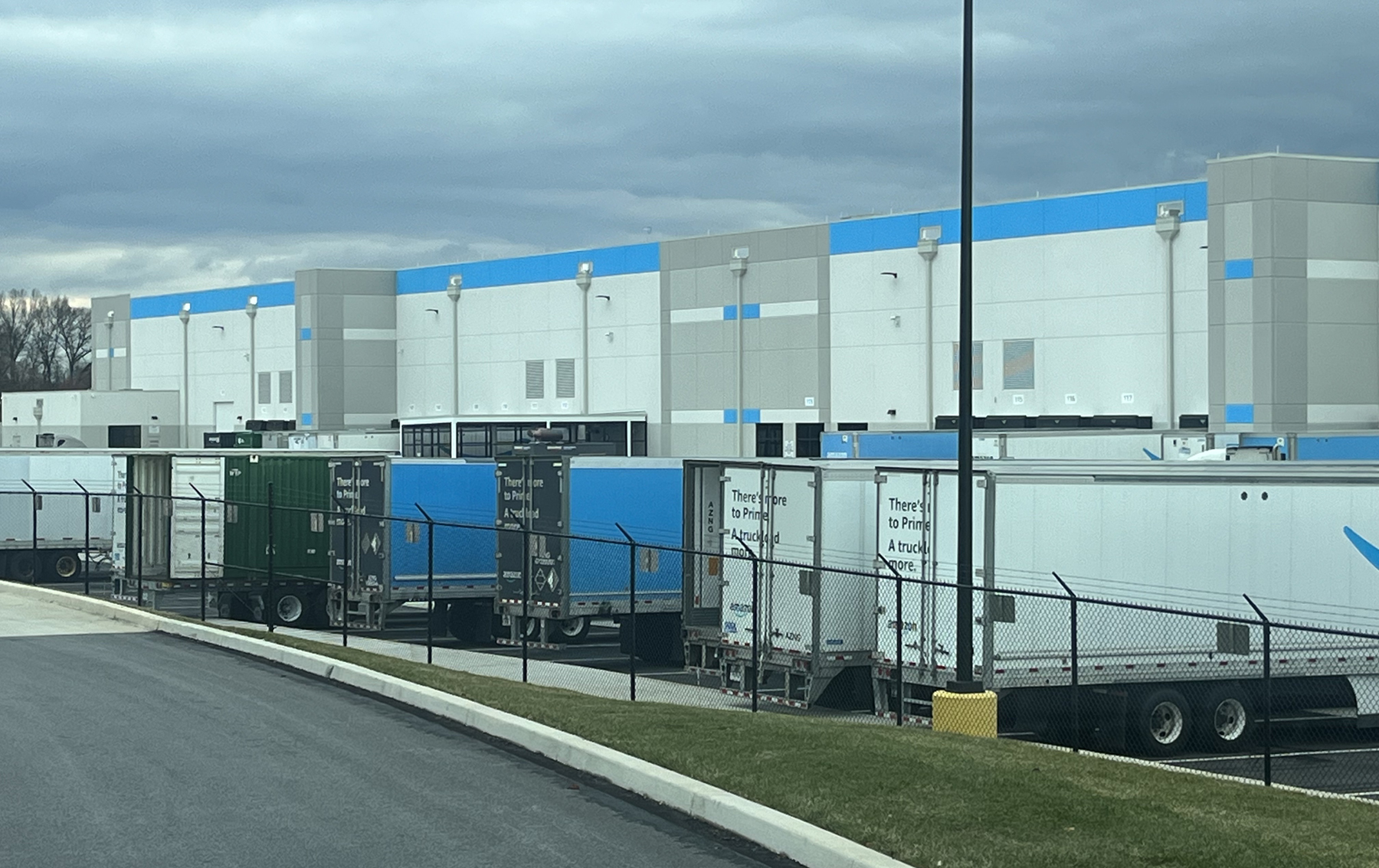 permanent fence installation around Amazon warehouse
