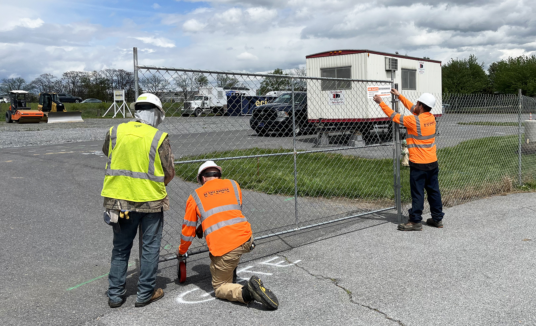 Be Safe Siteworks technicians installing gate for driven fence at a construction site