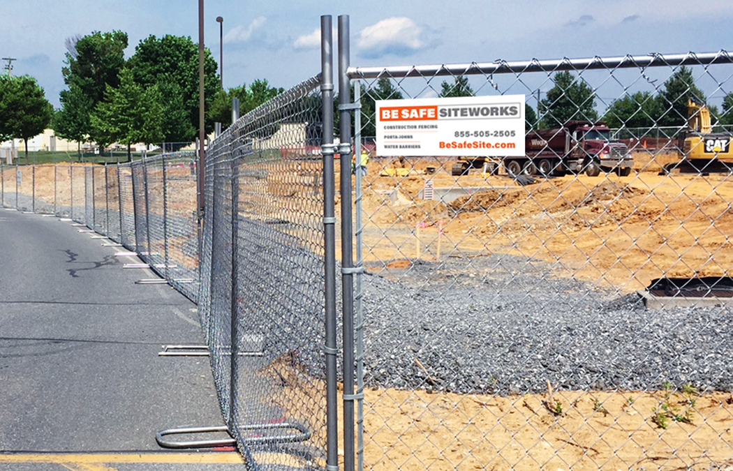 panel fence protects a large construction site
